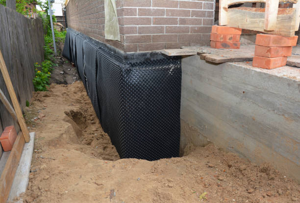 SJ Waterproofing Pros technician performing targeted Emergency Waterproofing assessment in Milford, IL